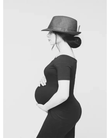 Adorable young mum in black dress