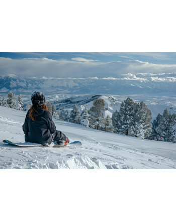 Woman enjoying snowboarding